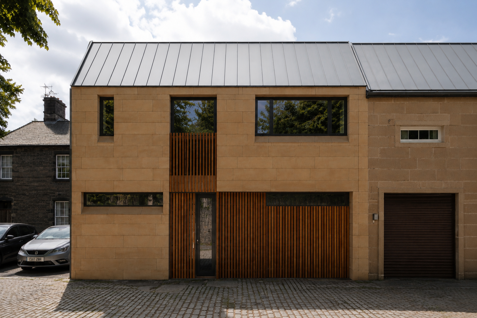 Contemporary Glasgow mews house with sandstone cladding, vertical timber detailing, large windows and a pitched zinc roof.