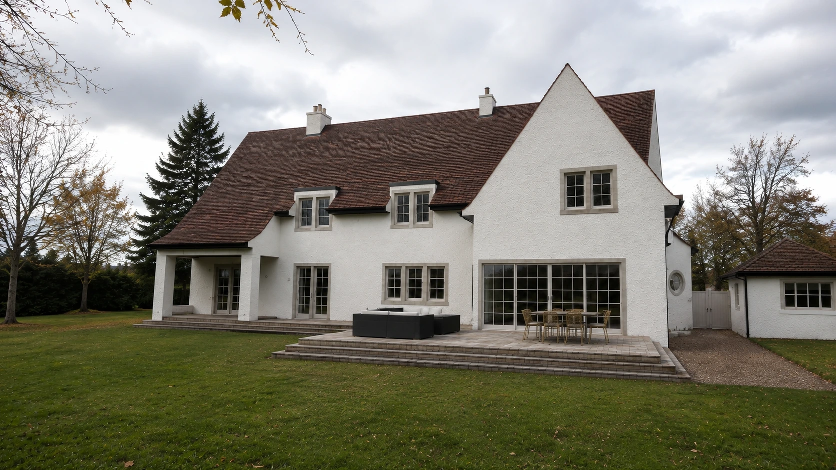 Photorealistic view of a traditional Arts and Crafts style family home with white rendered walls, red clay tiled roofs and landscaped grounds in Glasgow