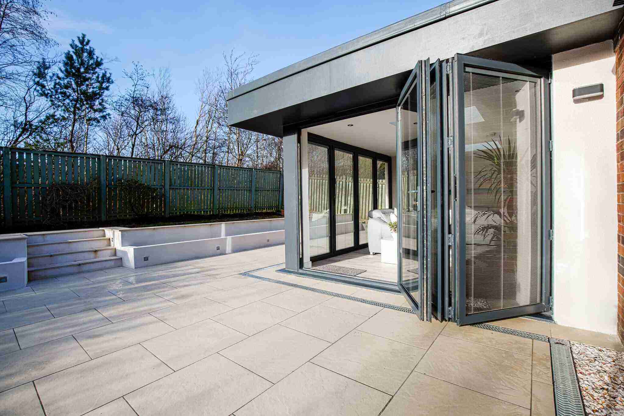 Kitchen extension with large aluminium bi-fold doors opening onto the garden in Newton Mearns
