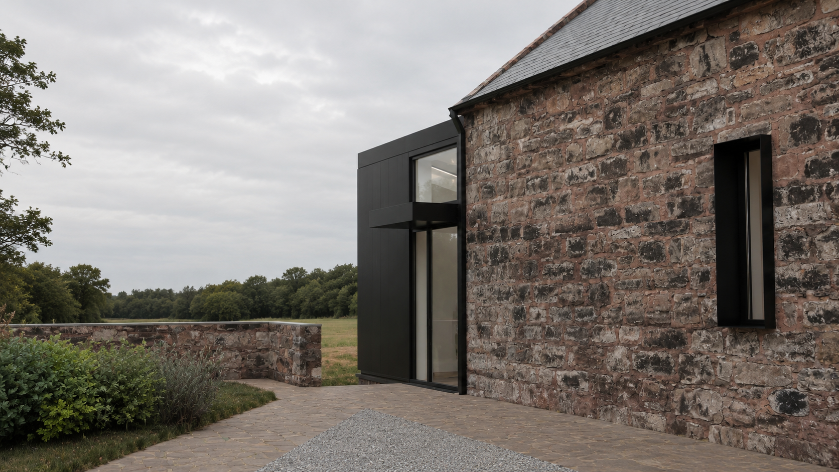 Modern barn conversion in Helensburgh with natural stone walls, black timber cladding and contemporary glazed openings.