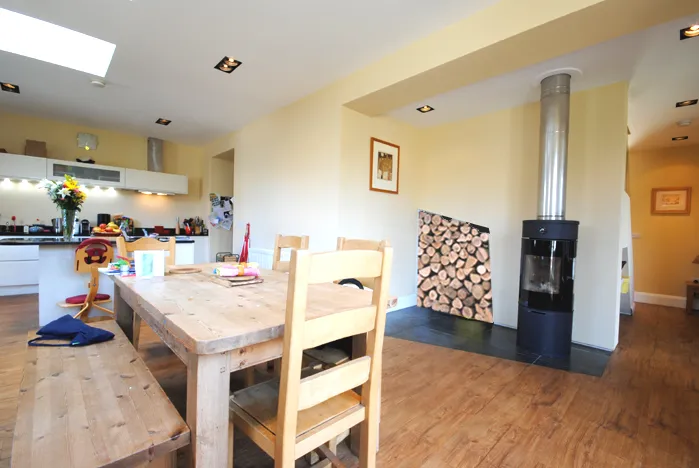 view of freestanding stove from dining room