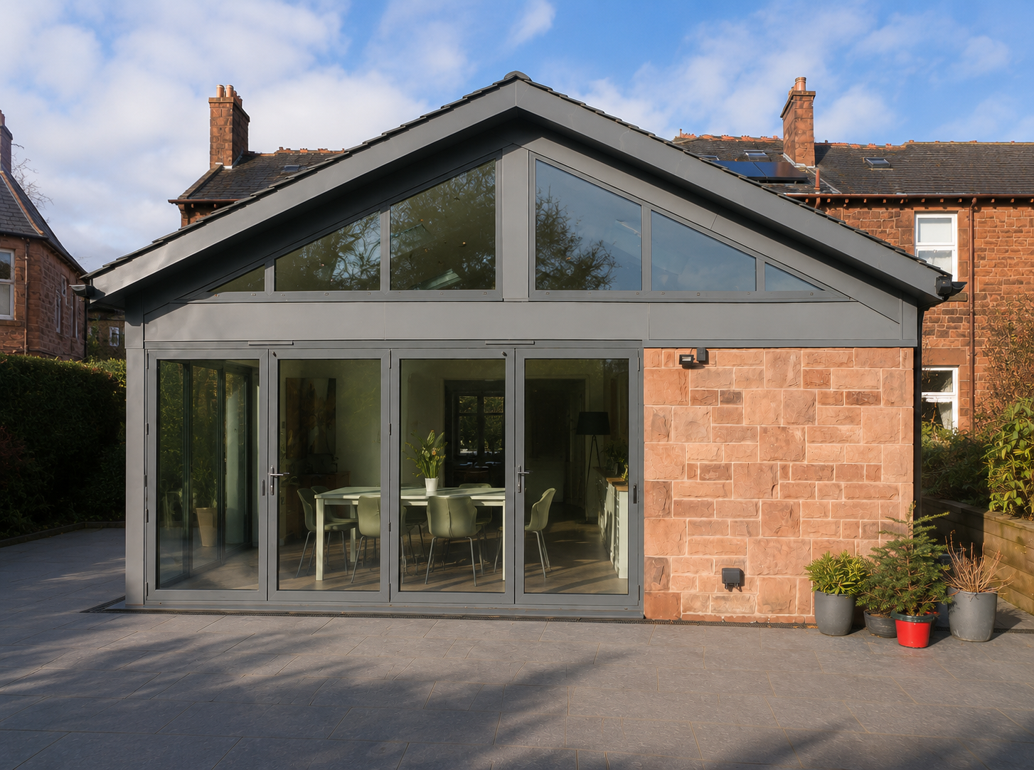 Rear extension to a traditional Glasgow sandstone home with natural slate roof and contemporary glazing