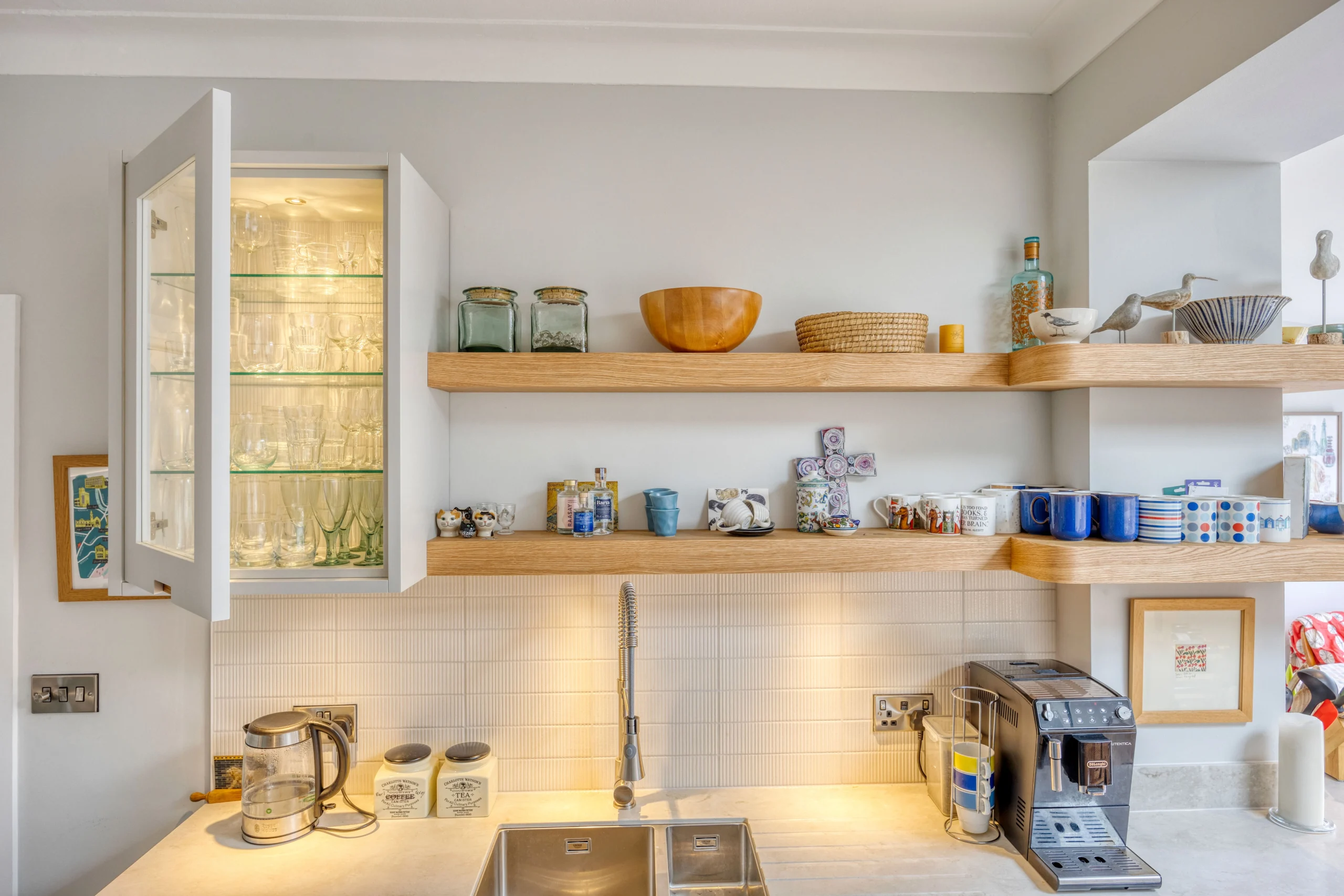 Dining area within a bright kitchen extension with large glazed doors opening onto the garden