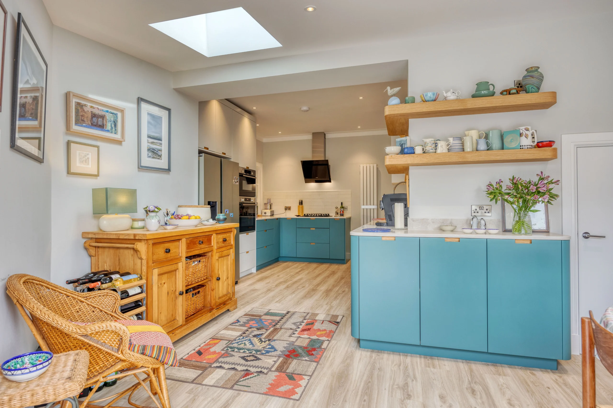 Contemporary kitchen extension opening directly onto a landscaped rear garden in Glasgow