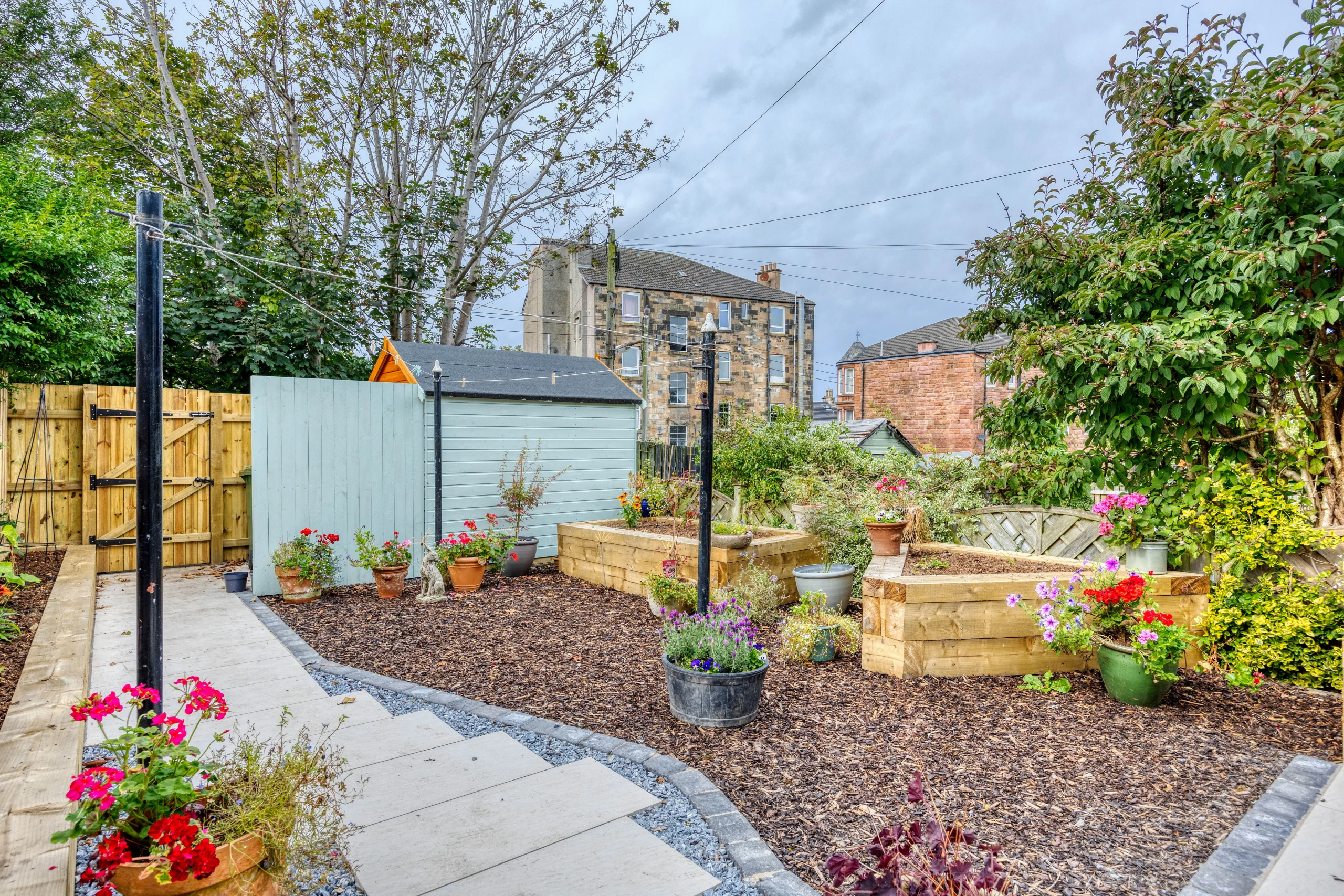 Landscaped rear garden and terrace connected to the extended kitchen and living space