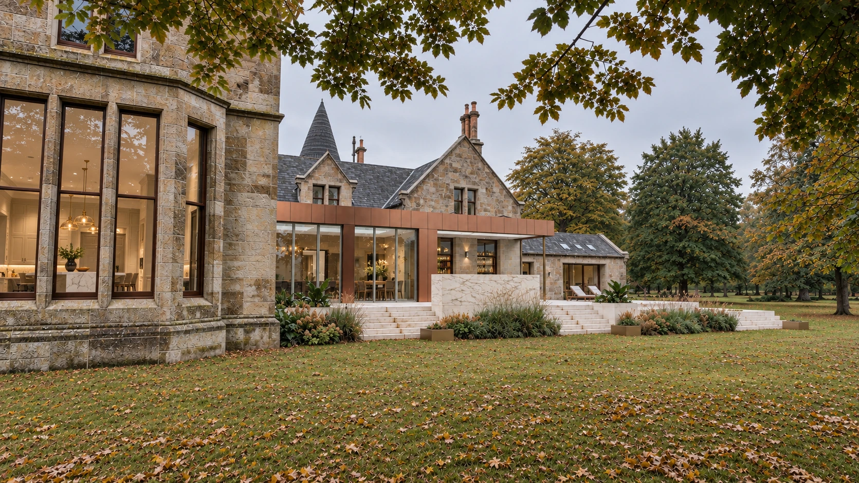 Copper-clad contemporary extension contrasting with the stone elevation of a period country mansion in Lanarkshir